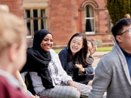 Students on campus, laughing