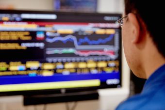 Student looking at stocks on computer