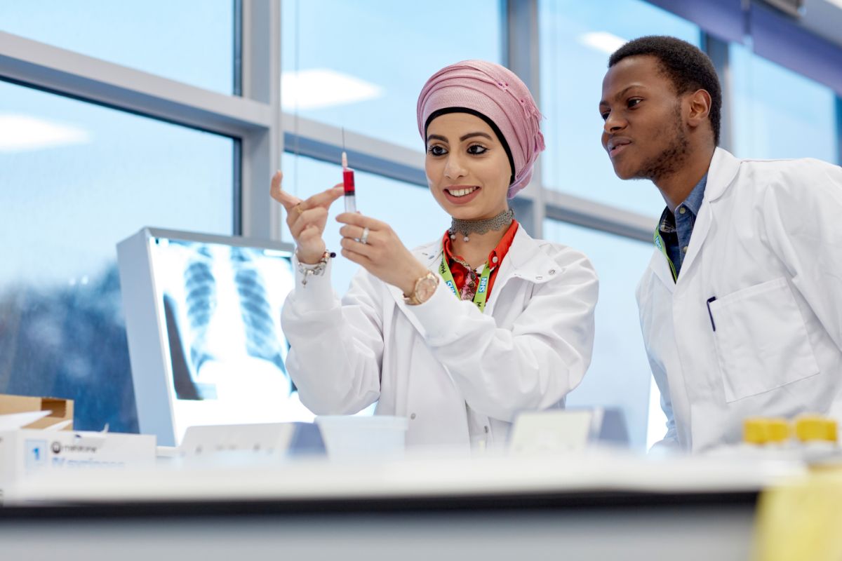 Two students in a science lab