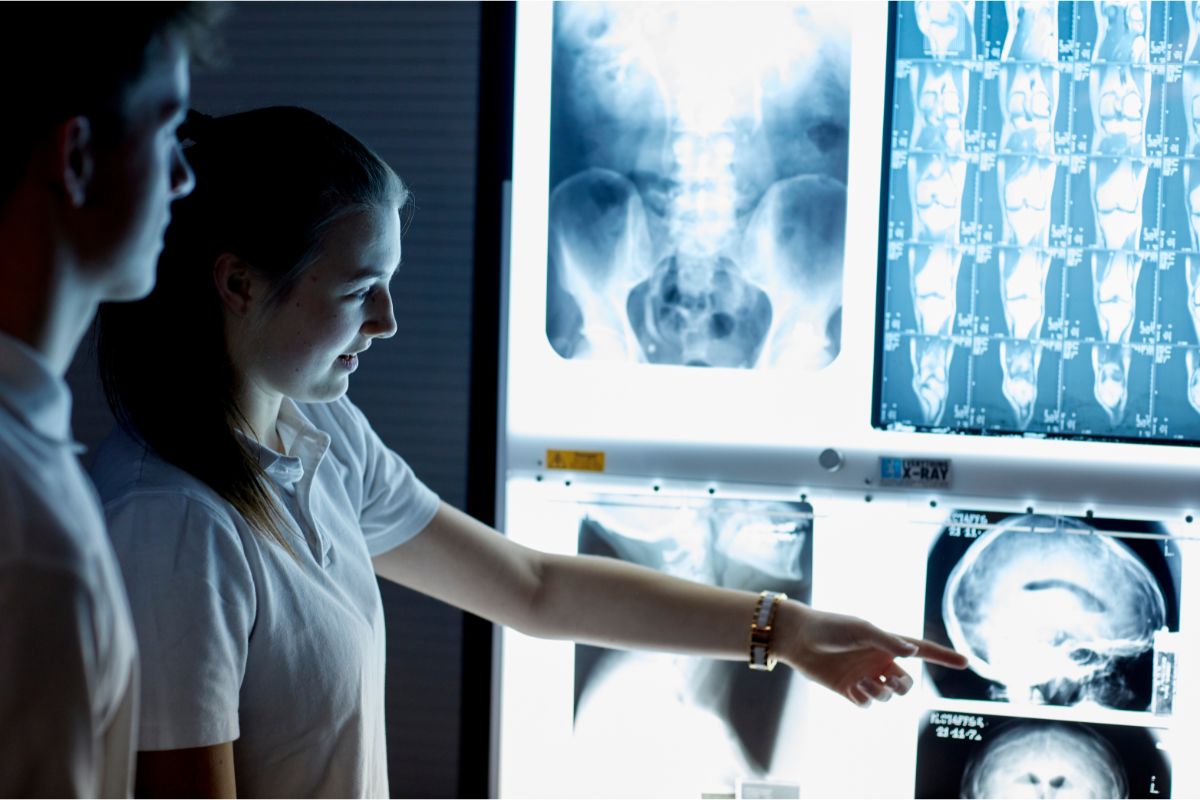 Radiography students examining x-rays