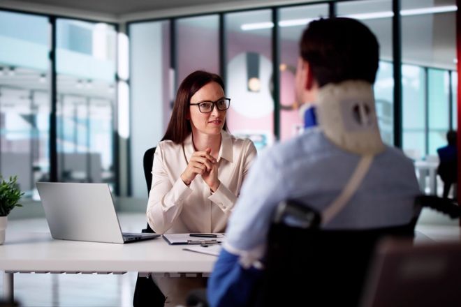 An advisor with a client in a law clinic