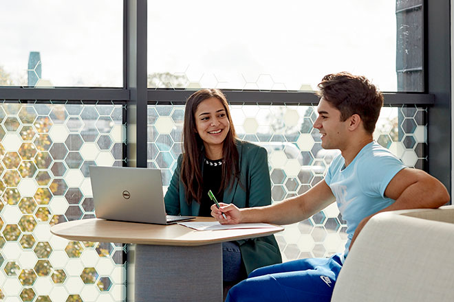 Students sitting and working together