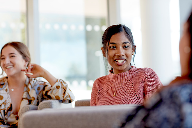 A student talking to another student
